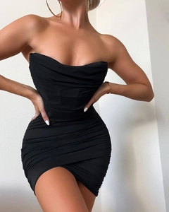 Detail of black mesh mini dress featuring ruching and asymmetrical overlapping hemline