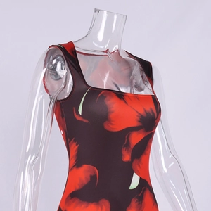 Detail of the square neckline and vibrant red floral print on the black stretch fabric