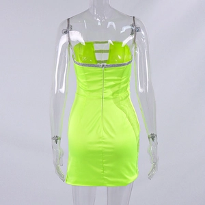Close-up of neon green mesh dress back with rhinestone trim and three-strap cutout detail