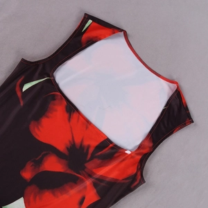 Detail of round neckline and floral print on black sleeveless summer dress fabric
