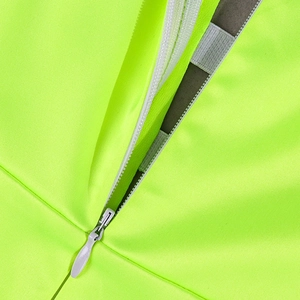 Detailed macro view of the invisible zipper closure on fluorescent green mesh dress fabric