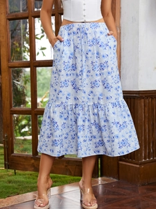 Detail of blue floral midi skirt showing elastic drawstring waist and side pockets