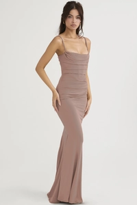 Detail of elegant dusty pink mermaid evening gown featuring side ruching and draped neckline