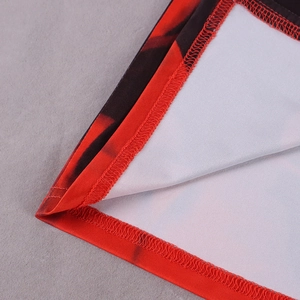 Close-up of high-quality overlock stitching and red digital print on backless dress