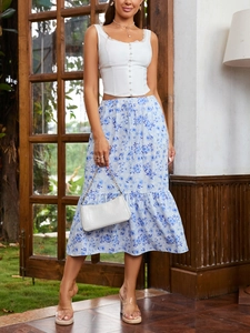 Detail of light blue floral midi skirt with ruffled hem and white lace sleeveless top set