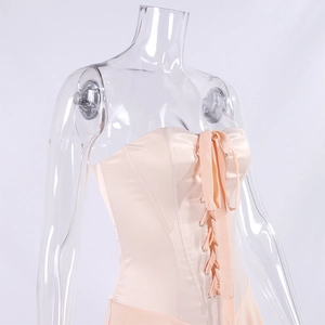 Detailed view of the lace-up corset front with metal eyelets on a satin dress