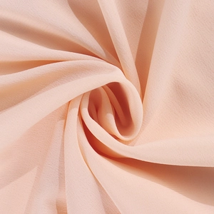 Detailed close-up of soft pink chiffon fabric showing elegant drape and fine texture