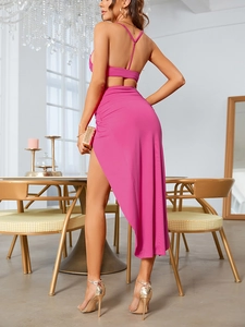 Detail of magenta two-piece set featuring cropped cami top and high slit maxi skirt