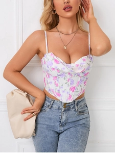 Detail of floral corset top featuring cowl neck and asymmetrical hem with boning detail