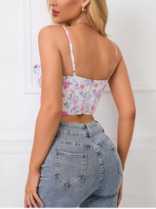 Detailed back view of floral crop top featuring slim straps and zipper closure detail