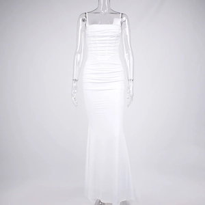 Detailed view of the gathered pleats and corsetry stitching on the white mermaid evening dress