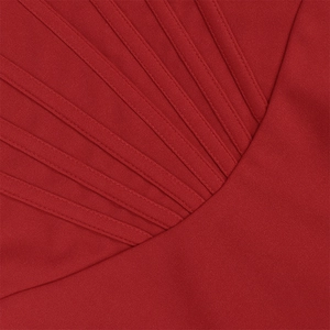 Detailed macro view of dark red lace corset dress with pleated stitching and fine texture