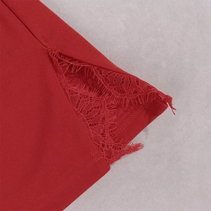 Detail of red eyelash lace stitching and high-quality fabric on a split hem dress