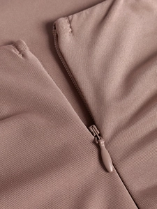 Detailed close-up of a high-quality invisible zipper on a pink mermaid dress
