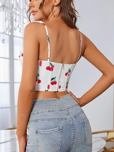 Detail view of the metal back zipper on this floral cherry print white crop bustier top