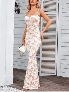 Detailed back view of a white floral maxi dress with lace-up ties and pleated textures