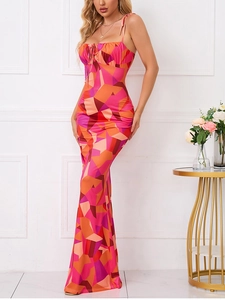 Detailed close-up of floral pleated bodycon maxi dress with backless tie design