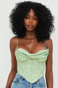 Detail of floral corset top featuring cowl neckline and structured boning in light green