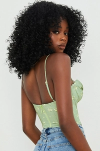 Detail view of floral print corset top with adjustable straps and back zipper closure