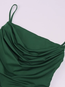 Detail of elegant dark green cowl neck silk dress with delicate spaghetti straps