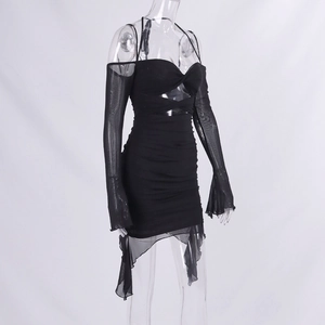 Detail view of black cut-out dress with sheer mesh flared sleeves and ruched mini skirt