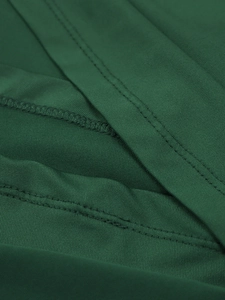 Detail showing high-quality double stitching and overlock edge on green fishtail dress fabric