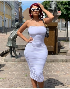 Detailed close-up of white ruched bodycon dress with spaghetti straps and slim fit design