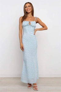 Detail of floral backless maxi dress featuring ruched bust and hollow lace-up design
