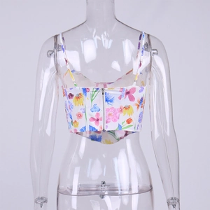Detail of floral crop top back showing the silver metal zipper and adjustable thin straps