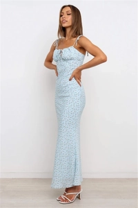 Detailed view of light blue floral dress showing pleated neckline and ribbon tie straps