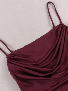 Detail of burgundy evening gown showing cowl neck design and delicate spaghetti straps