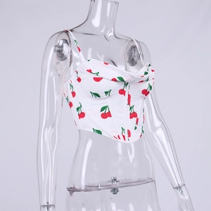 Detail of white cherry print corset top featuring thin straps and fishbone structure