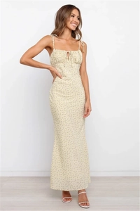 Detail of floral spaghetti strap maxi dress featuring ruched bust and tie-up design