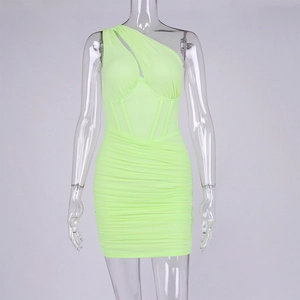 Detail of neon green mesh dress featuring diagonal one-shoulder cut and ruched bodycon fabric