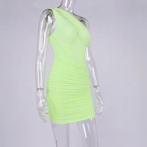 Detail of neon green one-shoulder corset dress with boning and ruched mesh texture