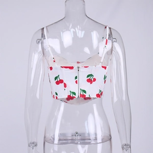 Detail view of the metal zipper and adjustable straps on the cherry print crop top