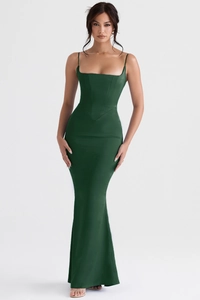 Detail of emerald green satin fishtail maxi dress featuring a structured corset bodice