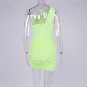 Detail view of the lime green bodycon mini dress showing ruching and backless design