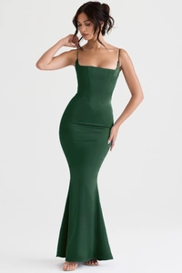 Detail of dark green satin evening gown featuring corset bodice and fishtail hemline