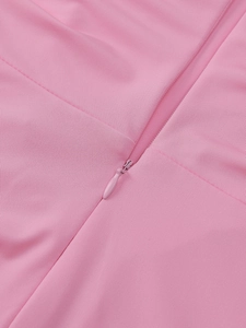 Detail view of pink dress featuring a high-quality invisible back zipper and smooth seams