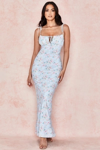 Detail of floral spaghetti straps with bow tie and ruched chest design on blue maxi dress