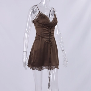 Close-up of brown satin mini dress featuring delicate lace trim and front lace-up detailing