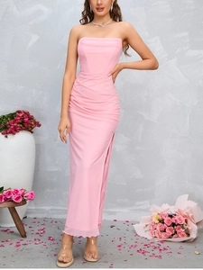 Detailed view of pink off-shoulder dress featuring side slit and elegant ruched textures