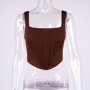 Detail of dark brown corset crop top featuring square neckline and vertical bone stitching