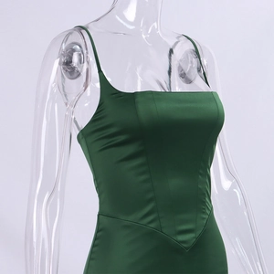 Detail of dark green satin bodycon dress with spaghetti straps and corset stitching