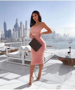 Close-up of pink ruched bodycon dress showing detailed texture and slim fit design