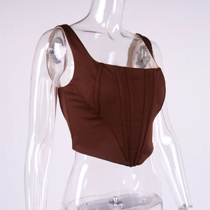 Detail of dark brown corset top featuring vertical boning and square neckline design