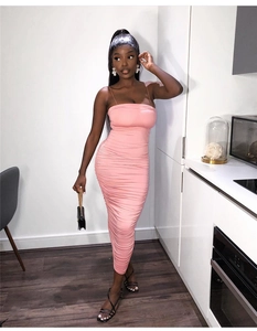 Detail of pink ruched bodycon midi dress with spaghetti straps and slim fit texture