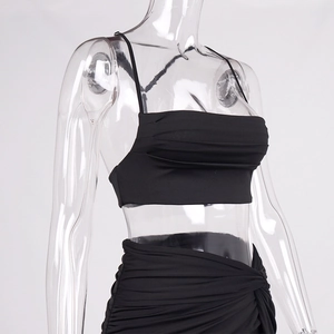 Detail of ruched texture and delicate spaghetti straps on this black two-piece summer set