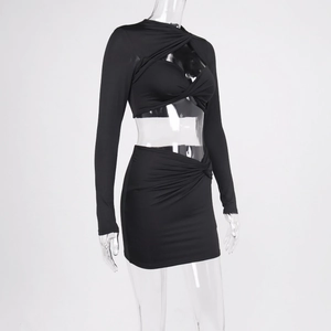 Detail view of black long-sleeve cutout twist crop top and high waist bodycon mini skirt